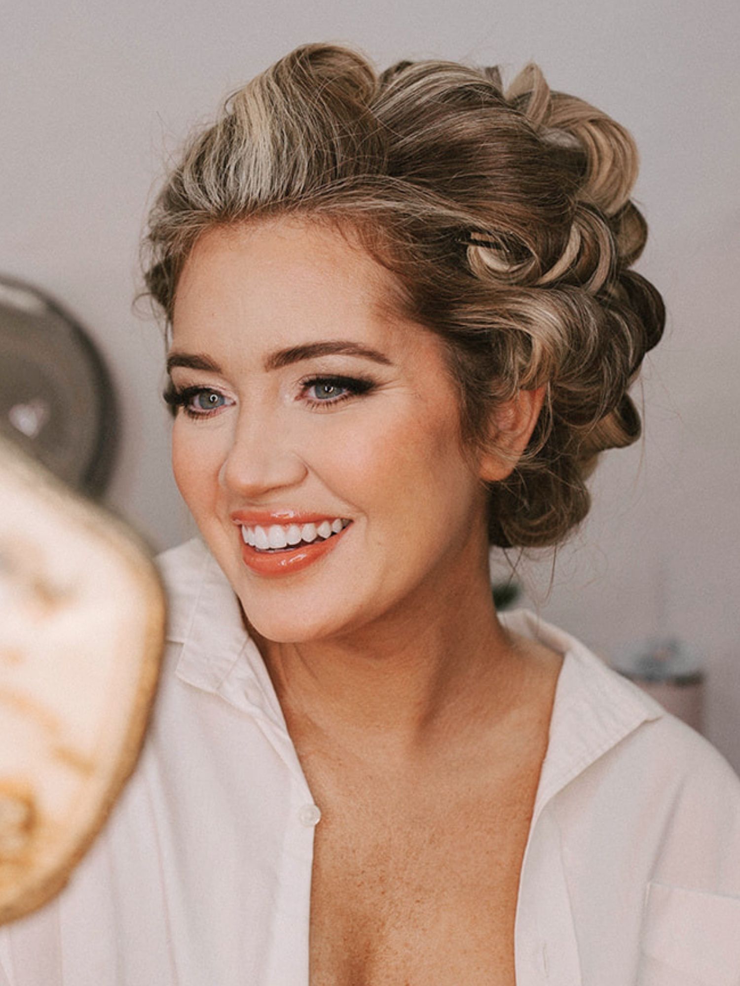 Hands styling a soft bridal twist