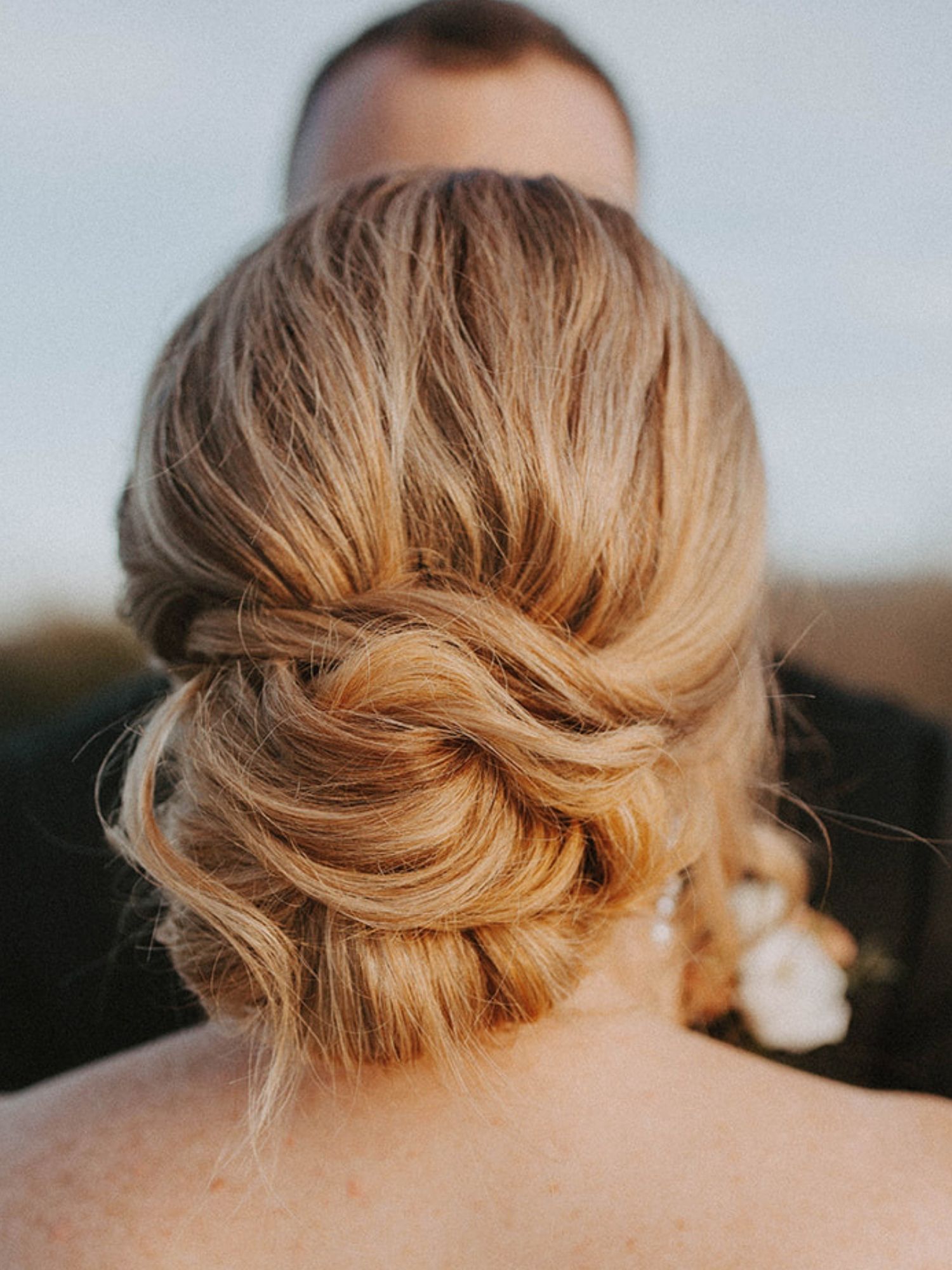 Finished bridal hairstyle with soft, polished waves